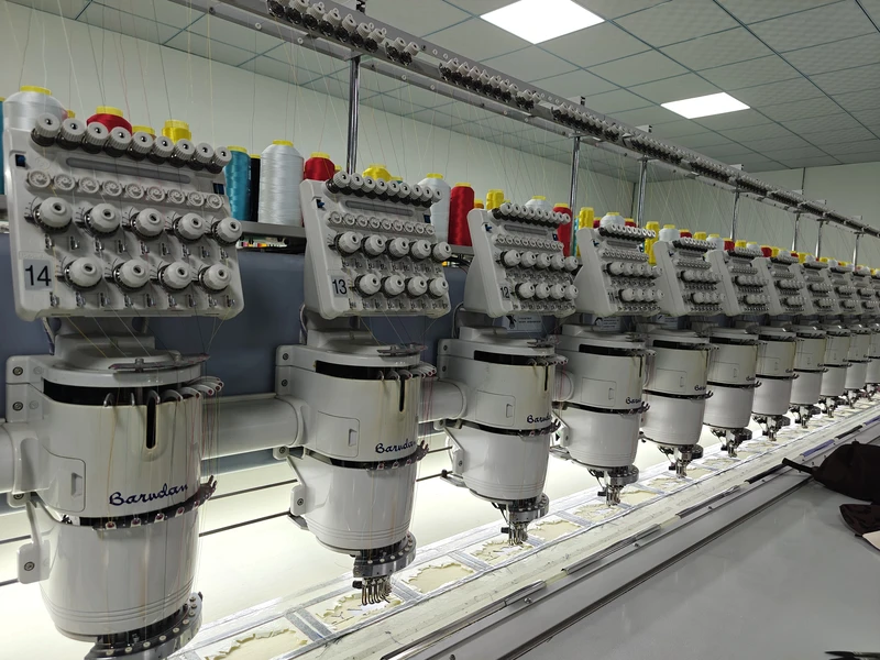 Rows of multihead embroidery machines in the Caps Mill headwear production workshop