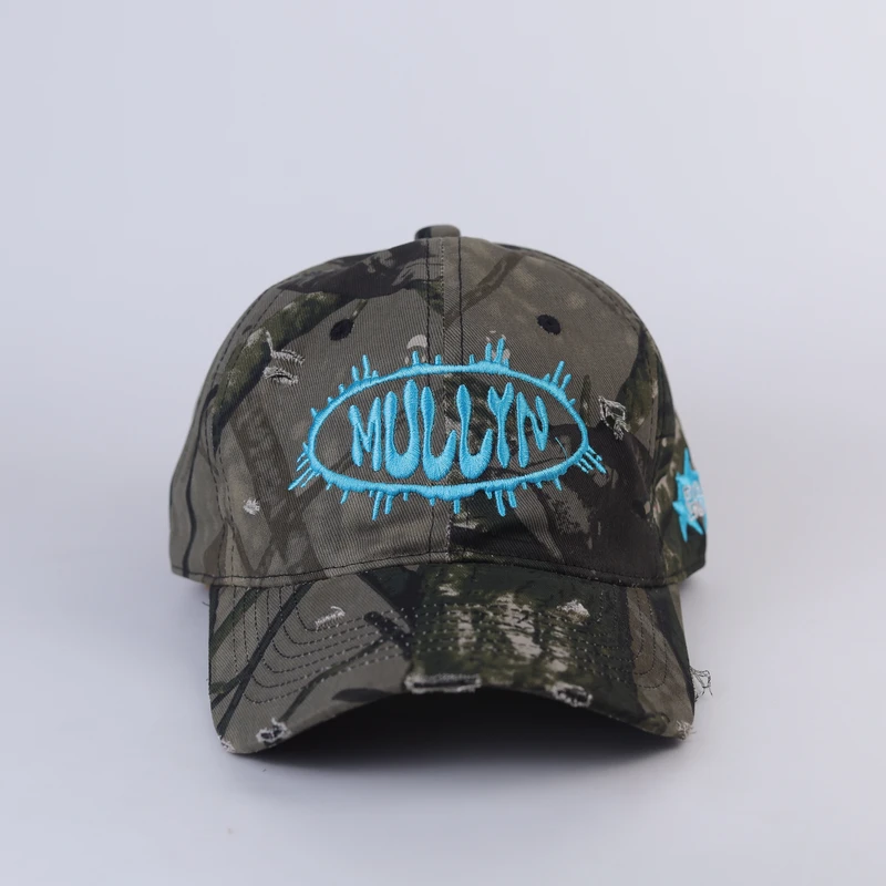 Woodland camouflage cap with turquoise front embroidery and distressed curved visor