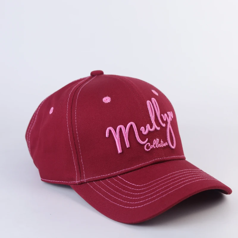 Burgundy cap with light script embroidery and matching curved visor, three-quarter view