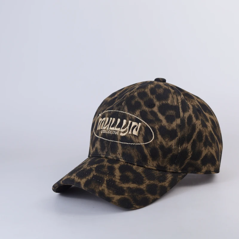 Leopard-pattern cap with small light front embroidery and curved visor, three-quarter view